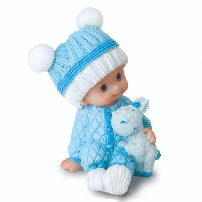Figura pastel niño bebé en pijama sentado con peluche